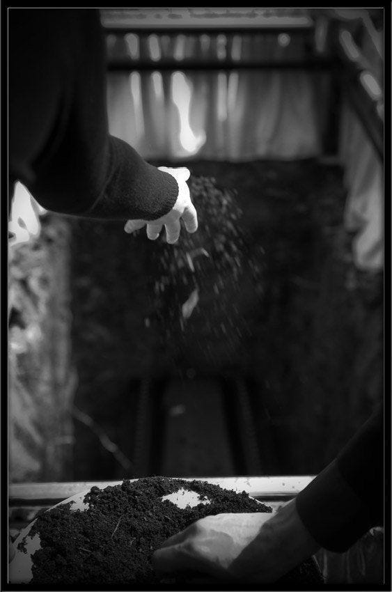 This may contain: a person is throwing dirt into the air