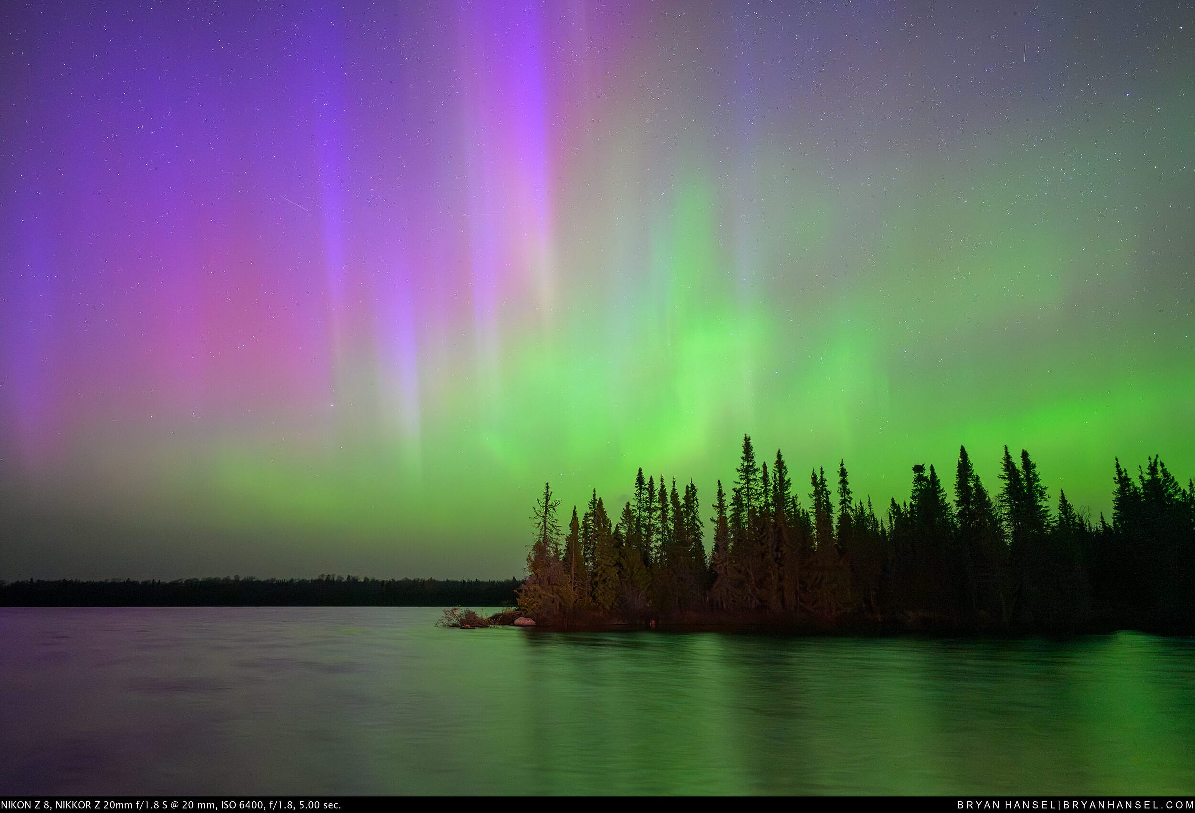 Northern Lights above a lake and spruce and fir covered point. Northern Lights above a lake and spruce and fir covered point.