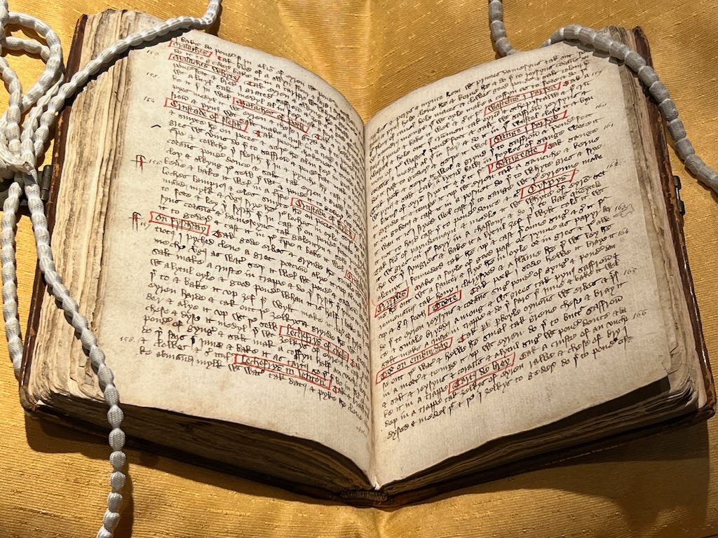 An old book with some words in red squares An old book with some words in red squares