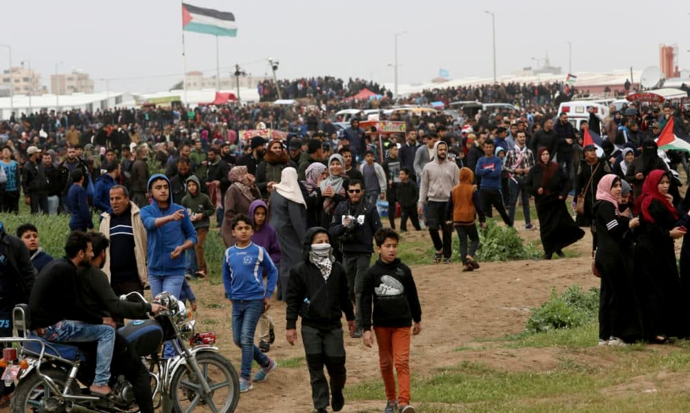 Protestors march toward the Gaza Strip's border with Israel, marking first anniversary of Gaza border protests east of Gaza City, Saturday, March 30, 2019. (Adel Hana/AP) Protestors march toward the Gaza Strip's border with Israel, marking first anniversary of Gaza border protests east of Gaza City, Saturday, March 30, 2019. (Adel Hana/AP)
