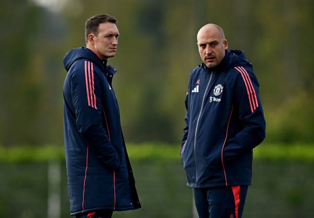 Manchester United coach Phil Jones, left, and U18 lead coach Adam Lawrence during the U18 Premier League Cup match between Tottenham Hotspur and...