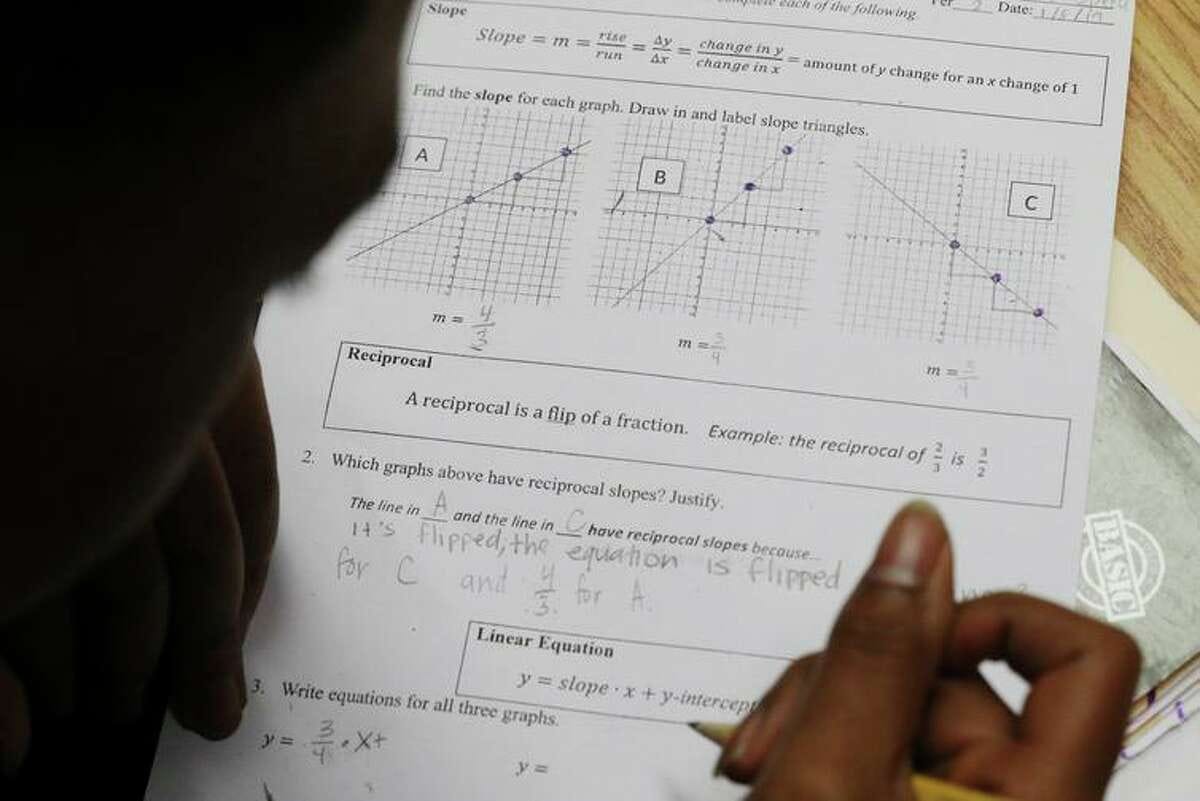 Mission High School junior Jamariae Speed works on a class assignment reviewing linear equations, slopes and reciprocals during Dayna Soares’ Algebra II class in San Francisco.