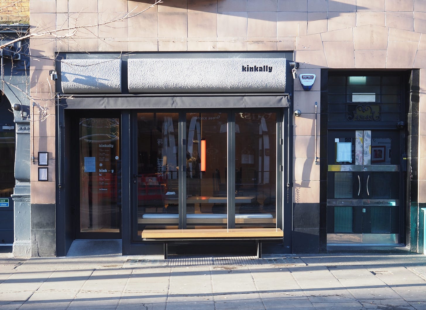 View from the street of the front of a restaurant.