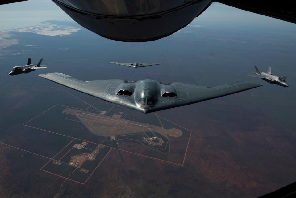 Aerial view of B-2 Spirit stealth bombers and fighter jets refueling during exercise Koolendong 22.