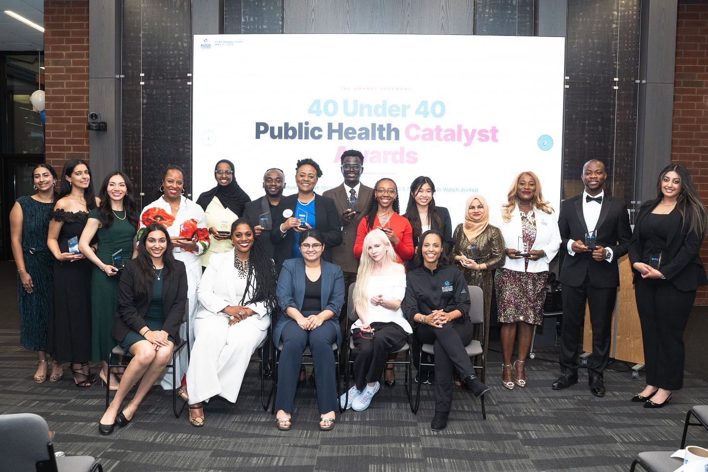 40 Under 40 Public Health Catalyst Award winners seated and standing with Dr. Kamilah Woodson, Attrayee Chakraborty, Dr. Circe Le Compte, and Dr. Candice Carpenter.