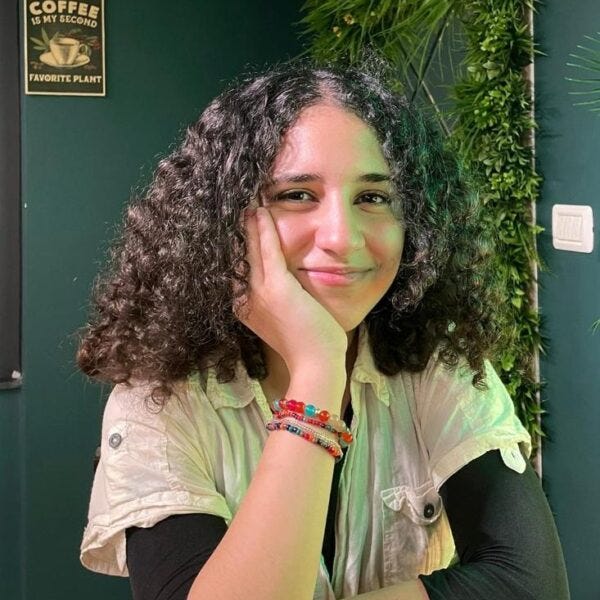 Young woman resting chin on hand. Young woman resting chin on hand.