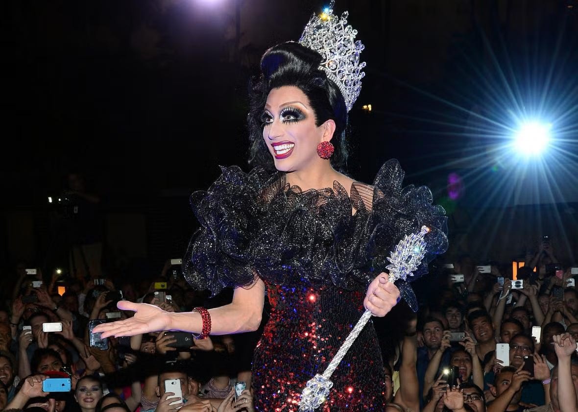 Bianca Del Rio with the prize crown and sceptre