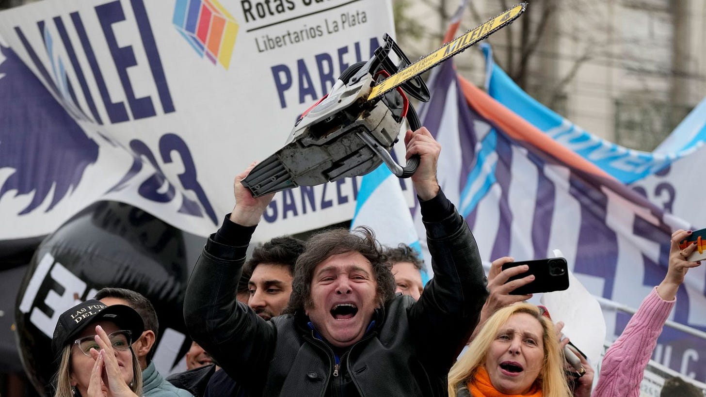 Presidential hopeful of the Liberty Advances coalition Javier Milei brandishes a chainsaw during a rally in La Plata, Argentina, on Sept. 12.