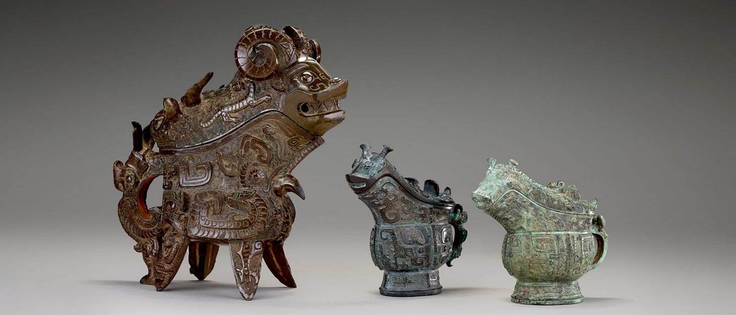 Three sculptural objects of varying ornateness depicting stylized animals Three sculptural objects of varying ornateness depicting stylized animals
