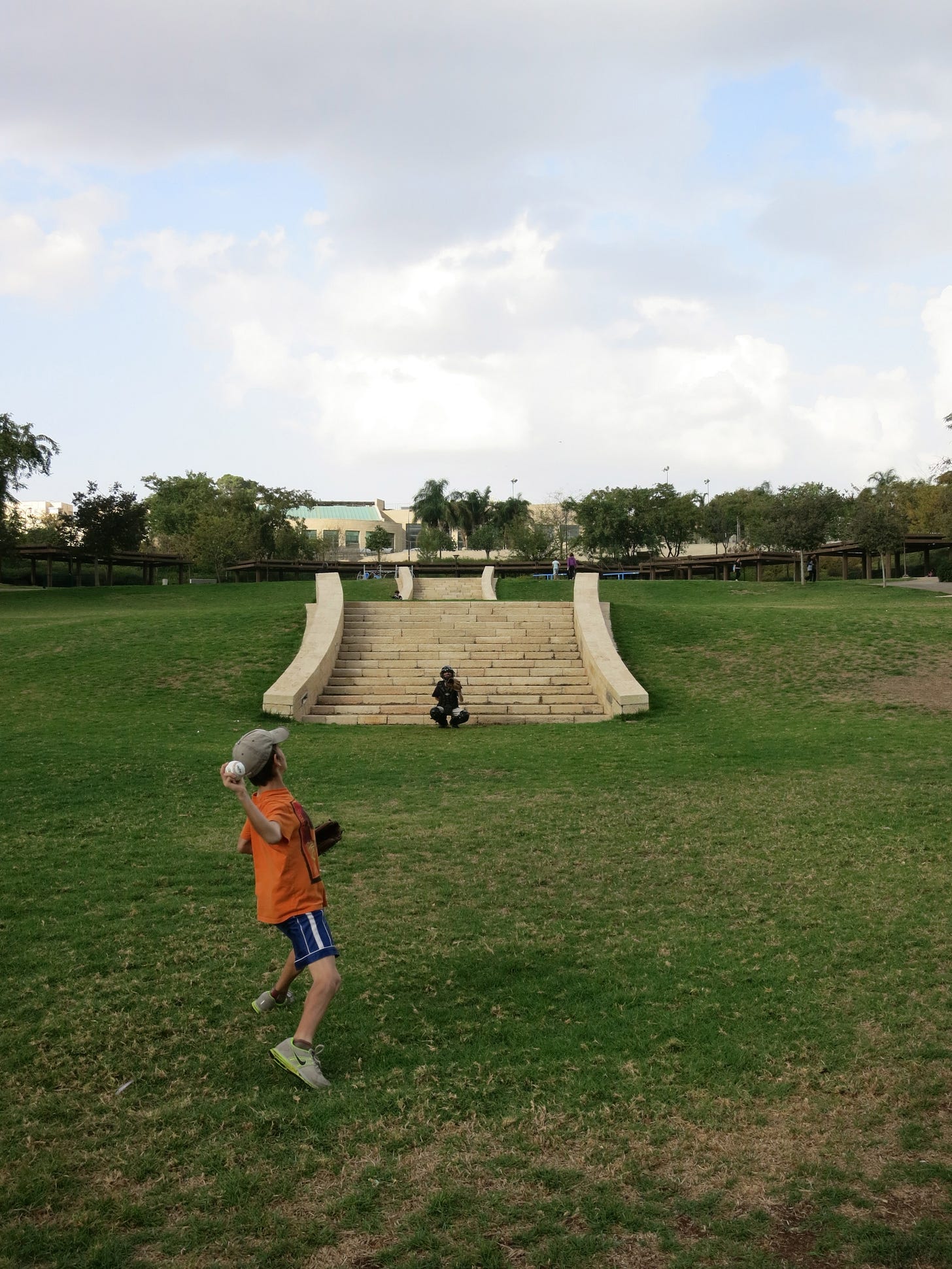 A Miracles pitcher throws in the "bullpen'