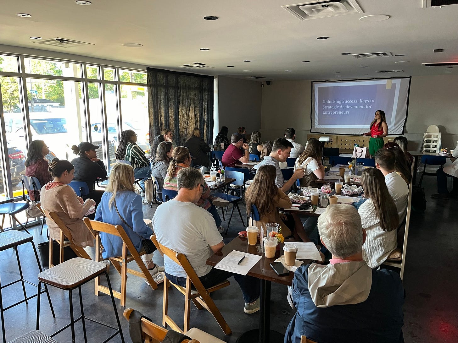 May be an image of 14 people, people studying, table and crowd