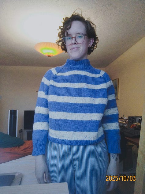 9 pictures of different fiber arts projects including a knit tapestry that says "Protect Trans Youth, a crochet tapestry of a wee ghost, a crochet blanket, a table runner, needle felted keychains, a butterfly cardigan for a little kid, and a blue and white striped cardigan for an adult.