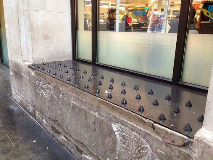An image of a bench that has raised spikes installed.