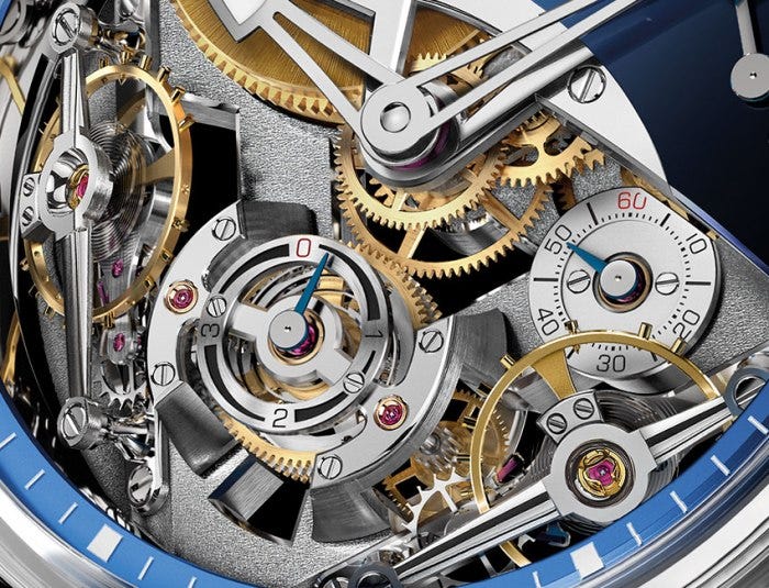 To improve precision, the spherical differential gear averages together the timekeeping rates from both balance wheels. To improve precision, the spherical differential gear averages together the timekeeping rates from both balance wheels.