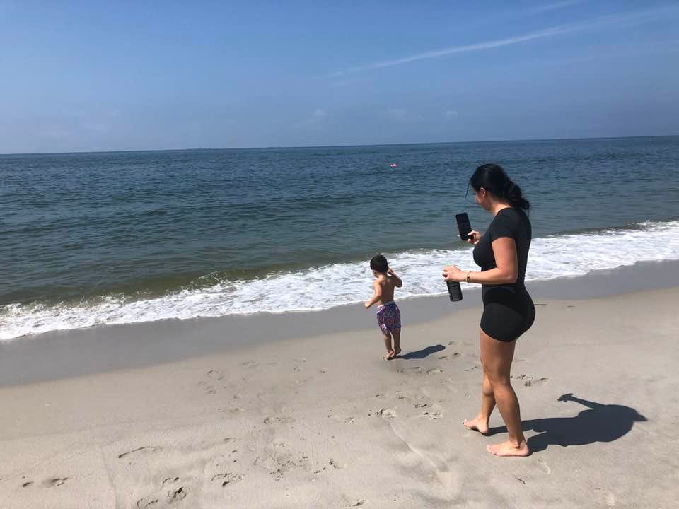 May be an image of 2 people, beach and ocean