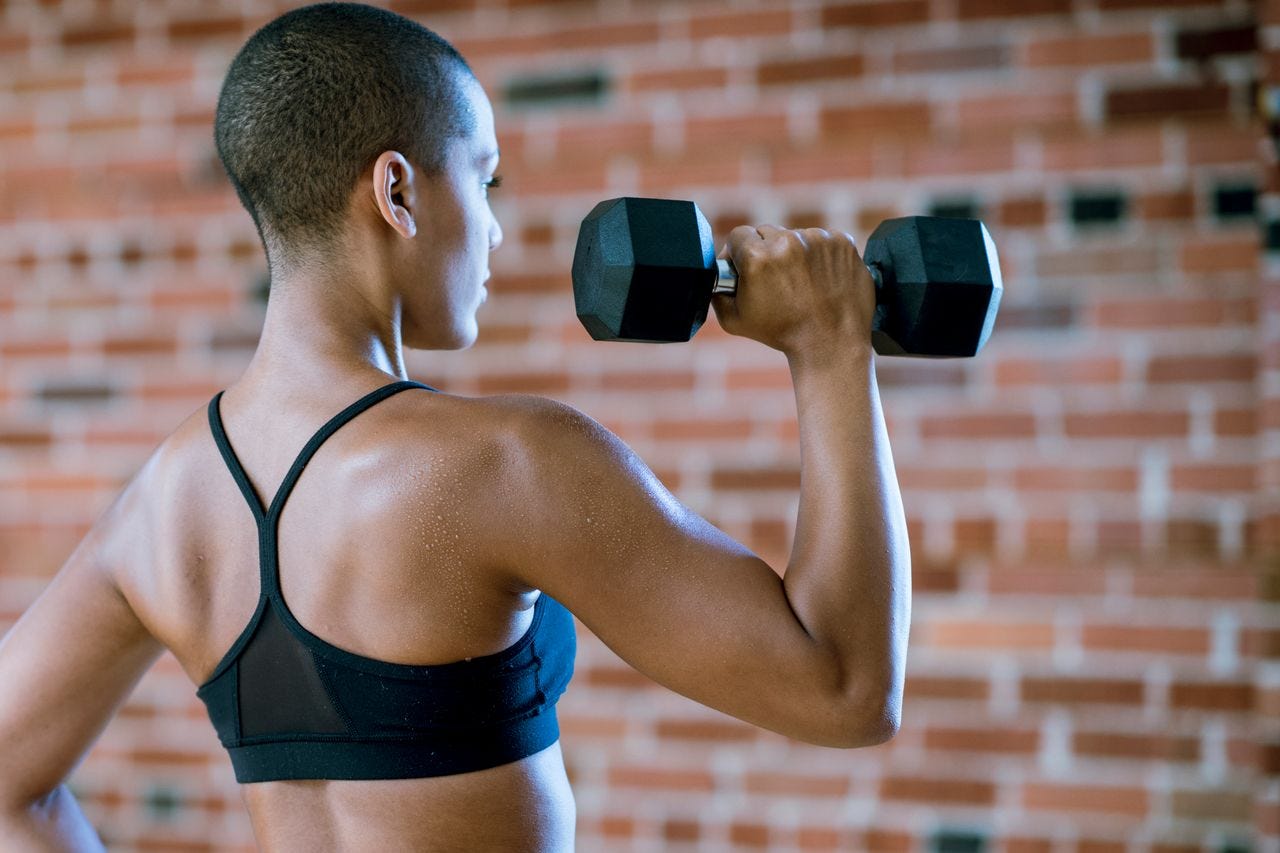 Woman holding a dumbbell.