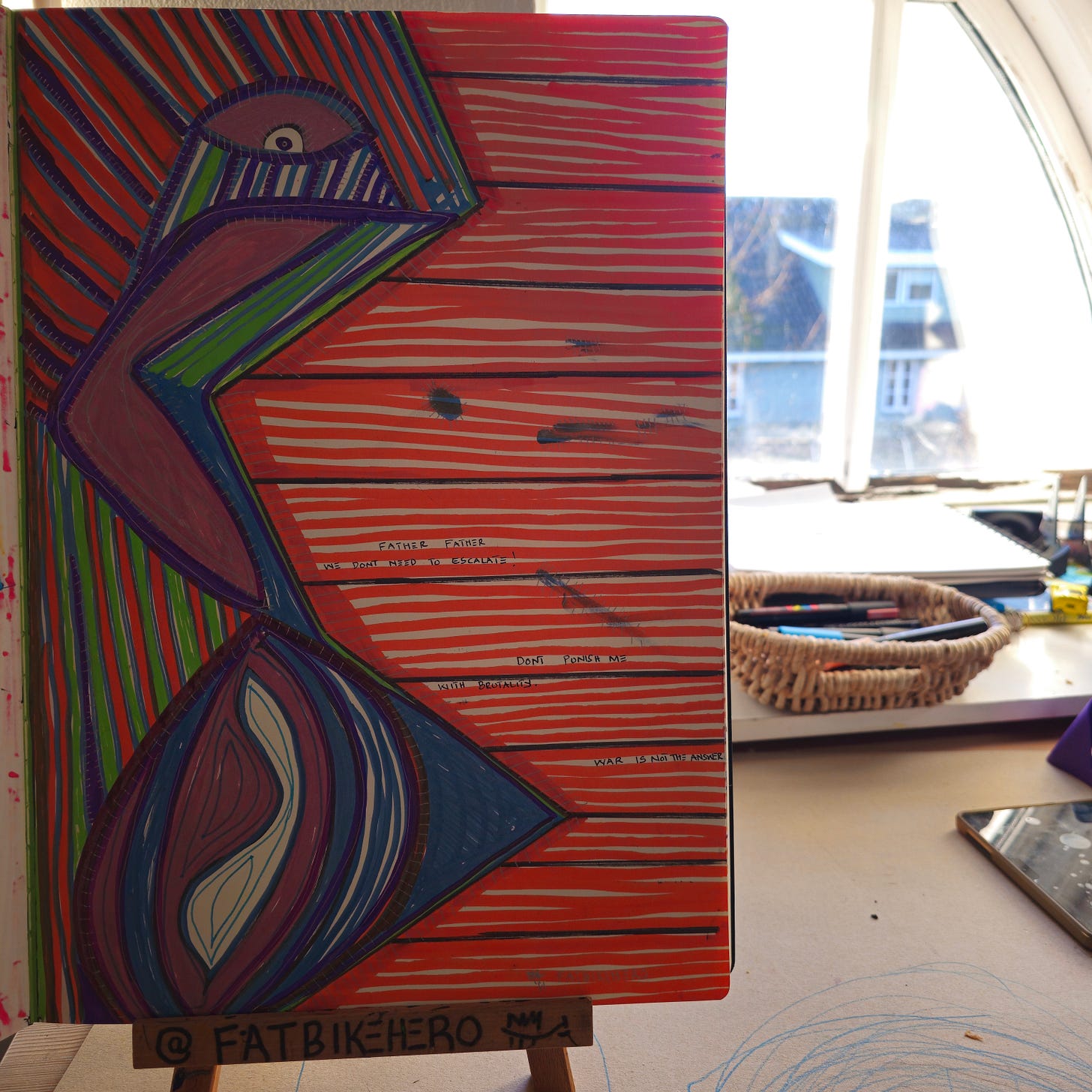 Alt Text:  A vibrantly colored, abstract marker painting by FatbikeHero. A stylized bird figure in purple, green, and blue is set against a background of intense horizontal orange stripes. Handwritten text on the painting reads "FATHER FATHER WE DONT NEED TO ESCALATE."