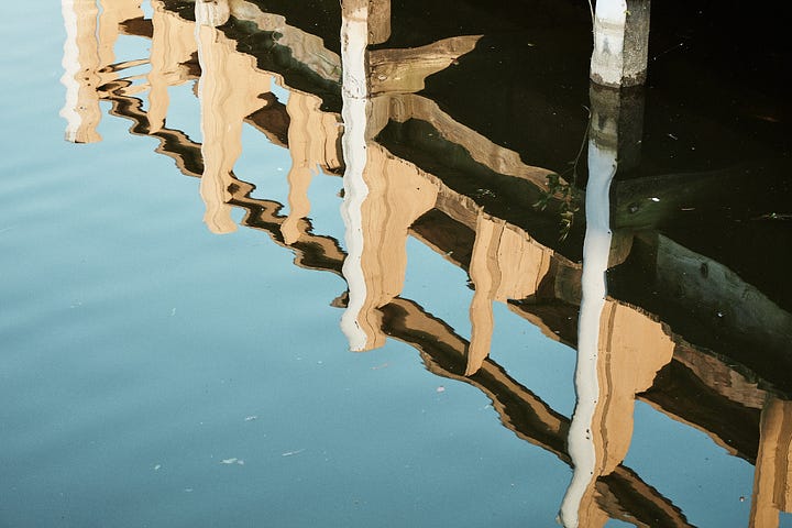 Yellow wood and blue-green water