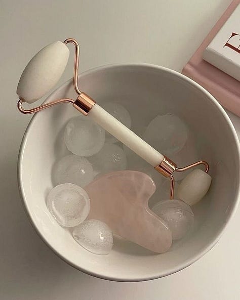 Collage showcasing a guasha tool and a face roller alongside serene skincare essentials, creating a calming aesthetic. The image highlights natural beauty tools for facial massage and relaxation, with soft lighting and gentle textures for a soothing skincare routine.