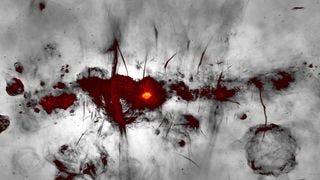 A new MeerKAT image of the galactic center region is shown with the galactic plane running horizontally across the image. Colors indicate bright radio emission, while fainter emission is shown in greyscale.