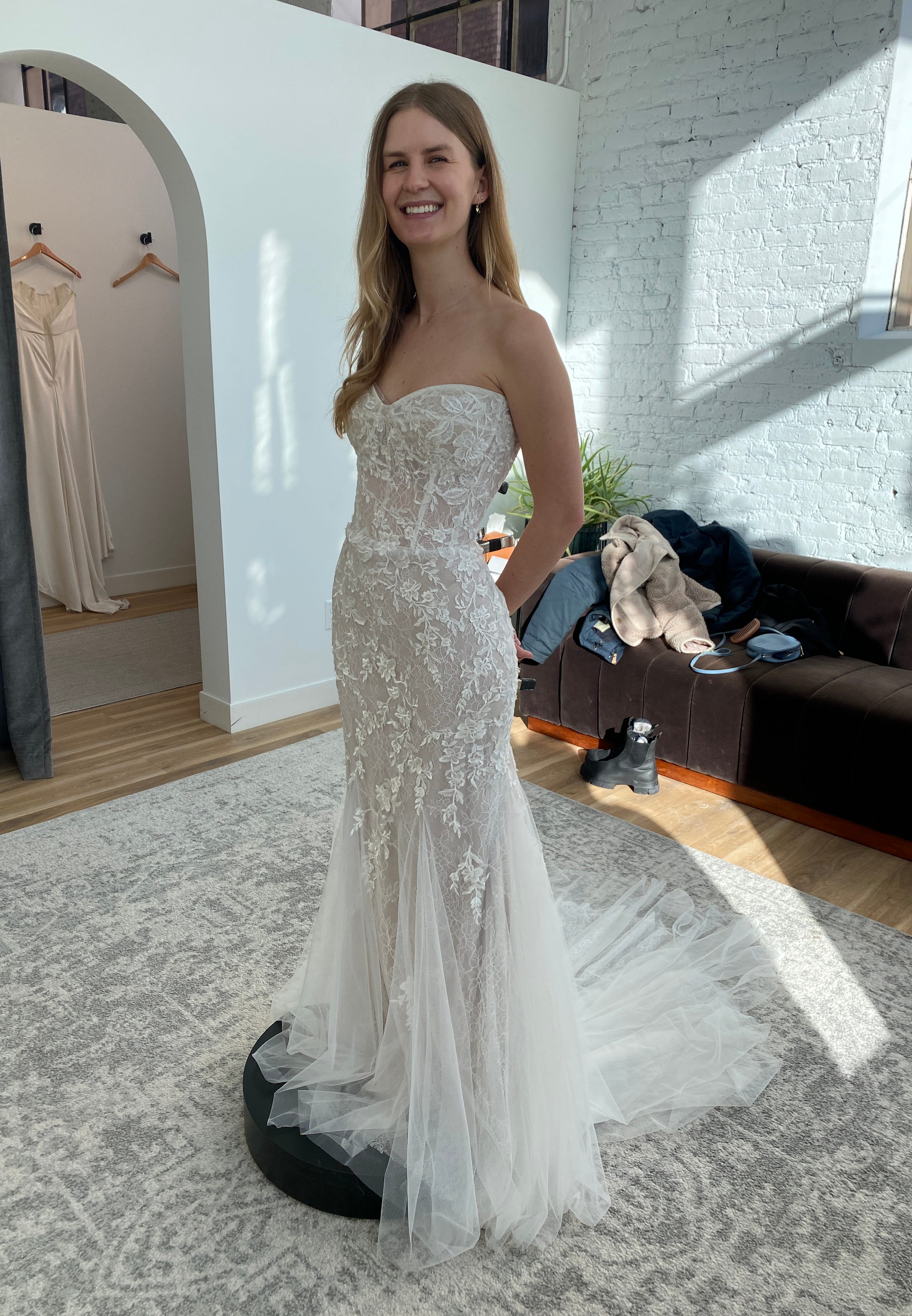 my wedding dress is too short Did the seamstress cut my dress too short? The 1st pic is me and the 2nd is  a pic from the designer. I feel like the bottom of my dress looks sloppy