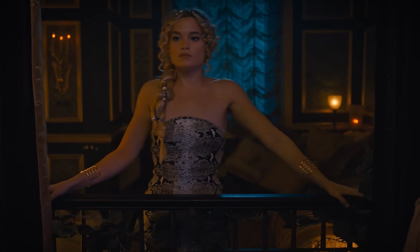A screenshot from Cruel Intentions (2024): a blonde teenage girl in a fancy dress looks out a window