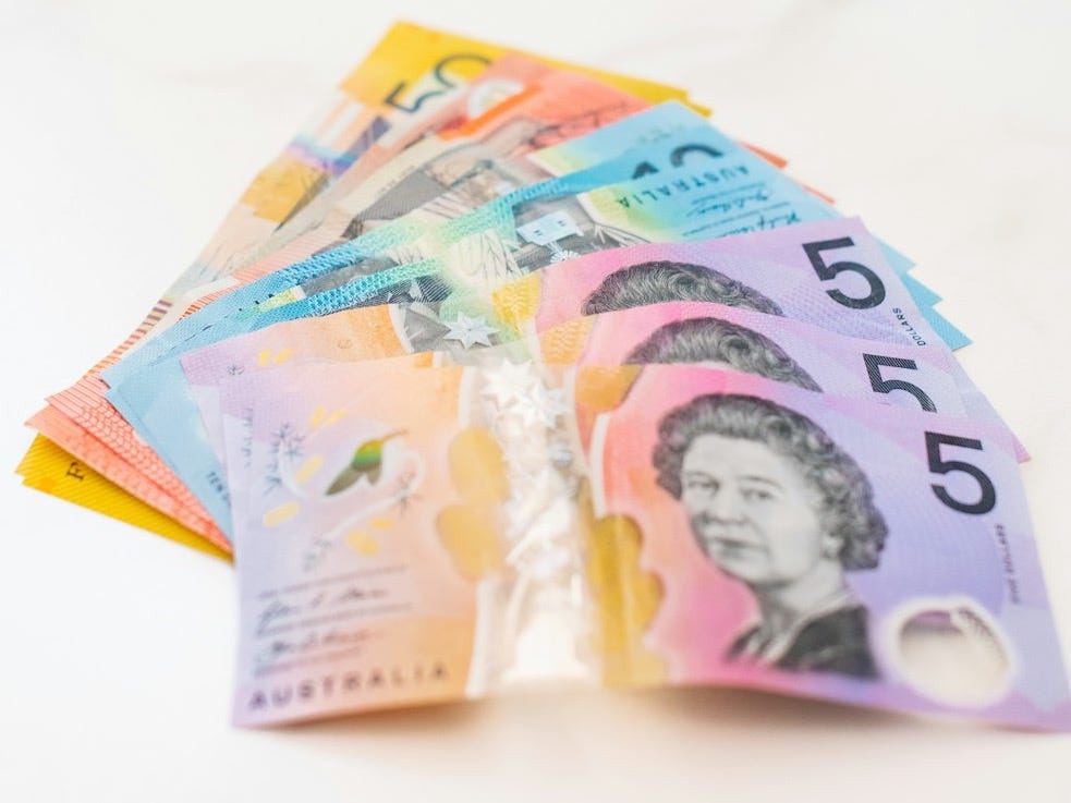 5 England banknotes on white textile