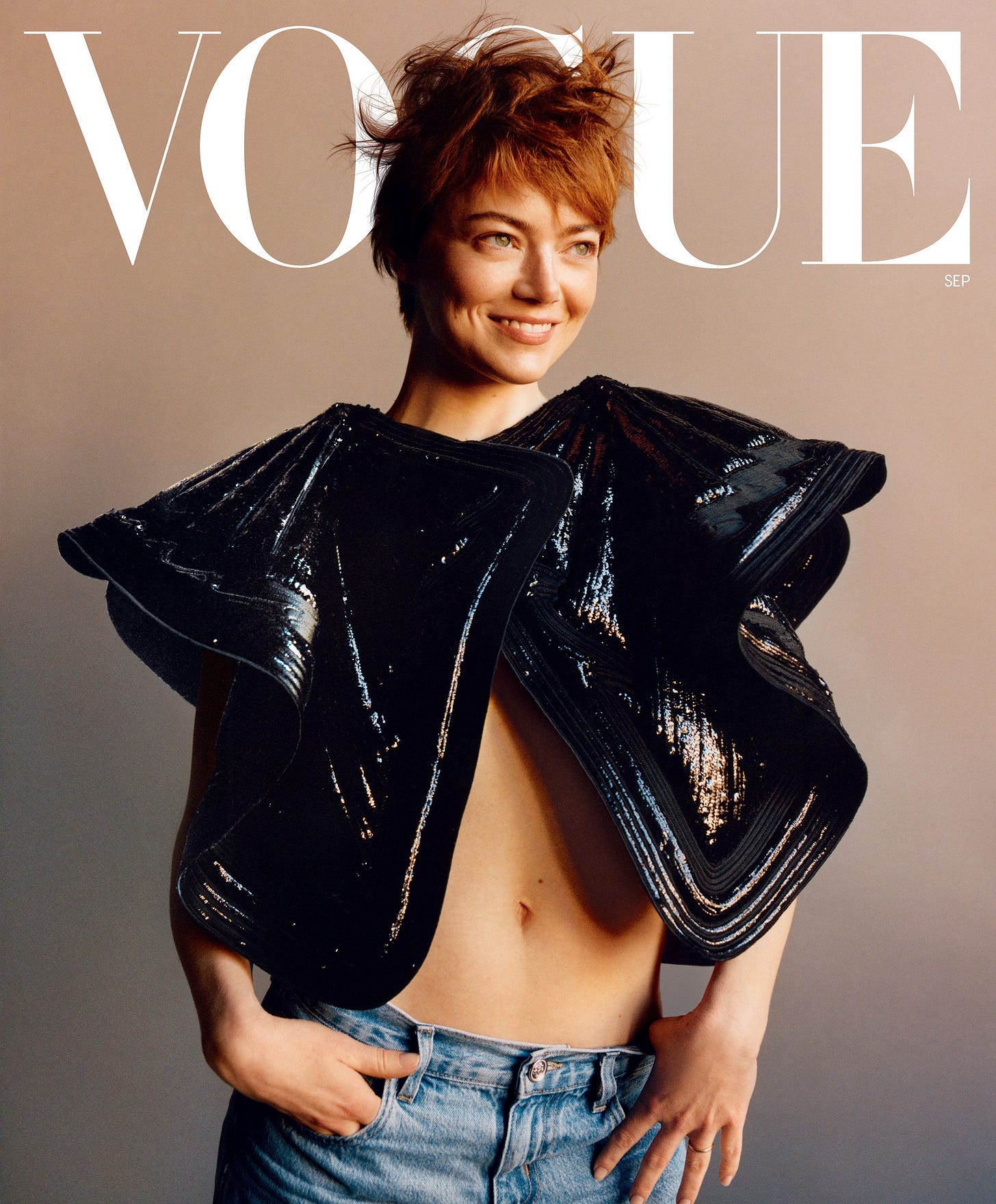 Image may contain Emma Stone Clothing Coat Jacket Blouse Publication Person Photography Accessories and Bag