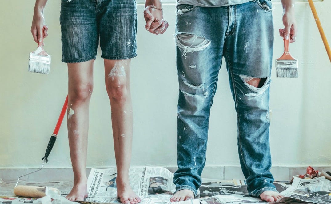 2 person wearing blue denim jeans 2 person wearing blue denim jeans