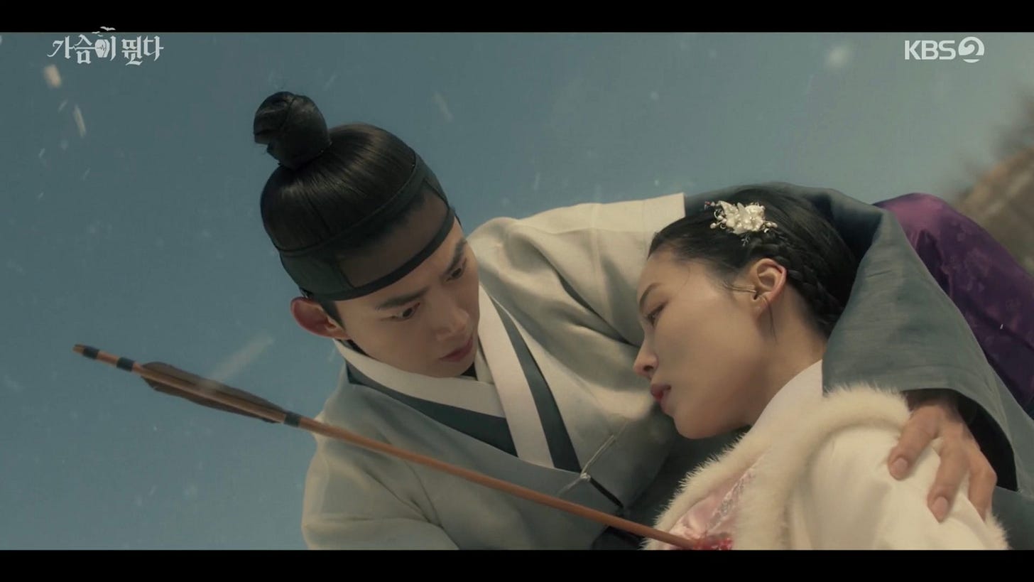 Woo-Hyeol holds a dying Hae-Sun, as she has taken an arrow for him.