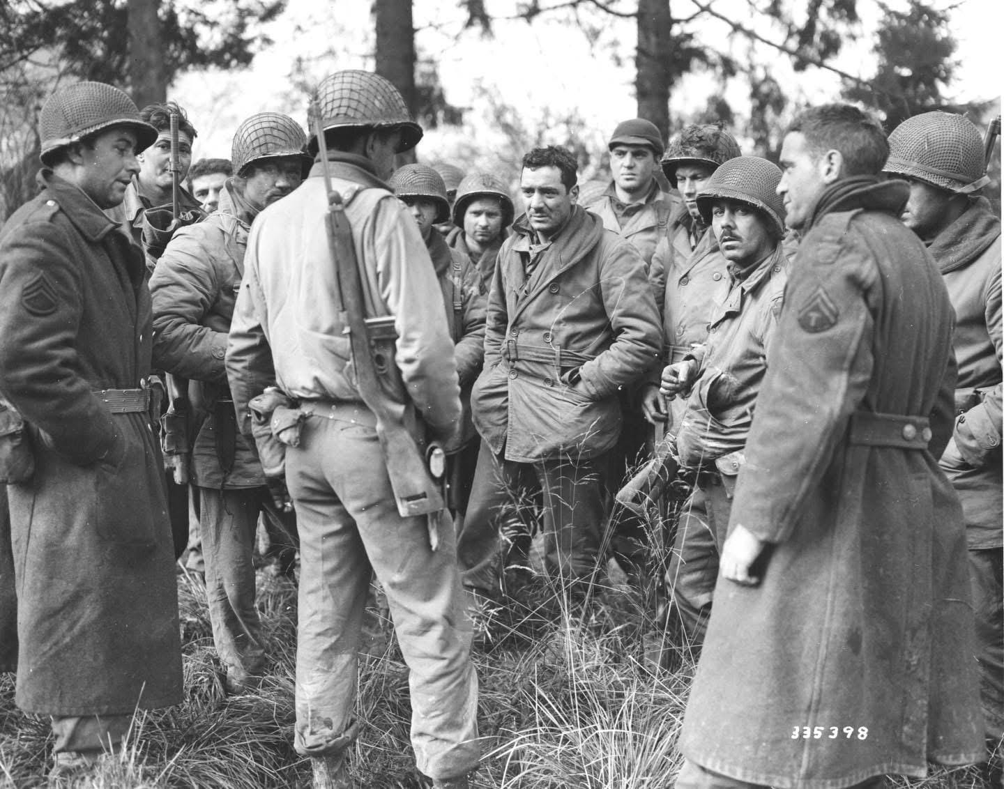 Heroic US Soldiers from the 28th Infantry Division Band and Quartermaster Companies, who bravely held out against the German advance in Wilts, Belgium, until ammunition ran out, pictured in Bastogne during the Battle of the Bulge, December 20, 1944.