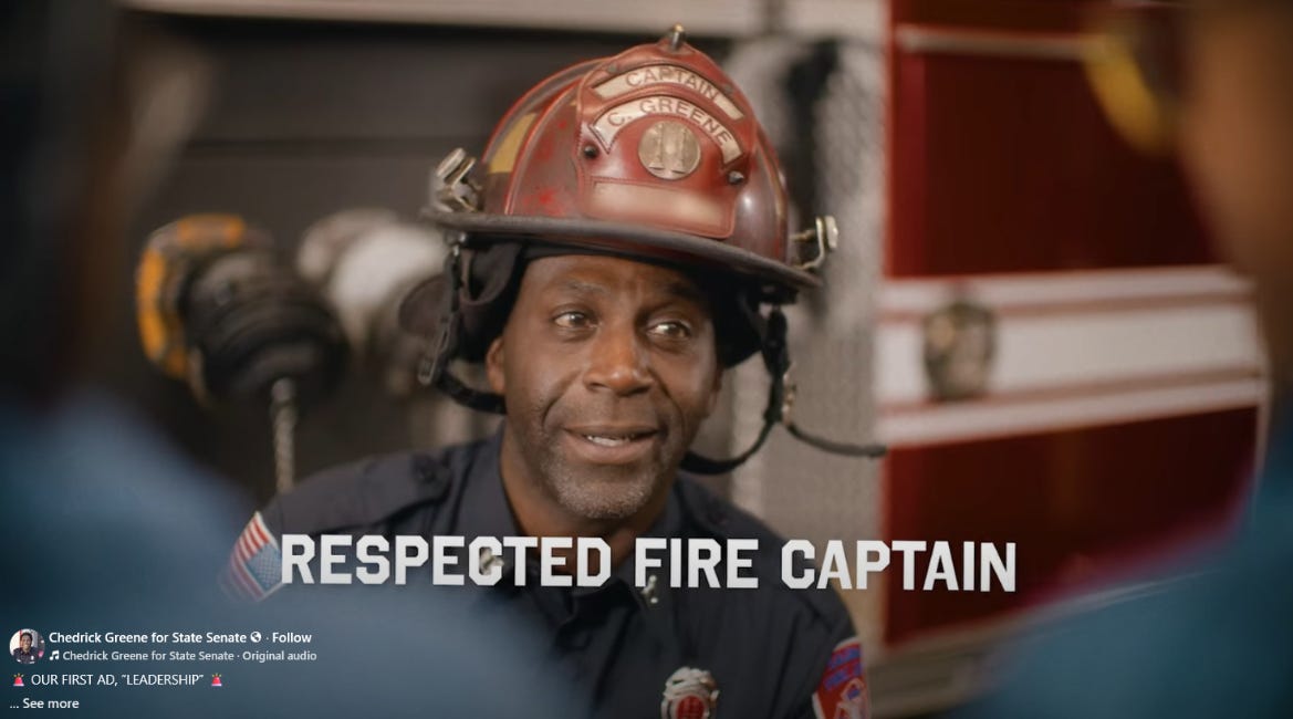 A screenshot from a Chedrick Greene for State Senate campaign ad. Greene wears a fire helmet. The text reads "Respected Fire Captain."