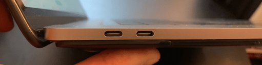 left side view of a 2019 macbook pro 13in laptop showing two USB-C ports left side view of a 2019 macbook pro 13in laptop showing two USB-C ports