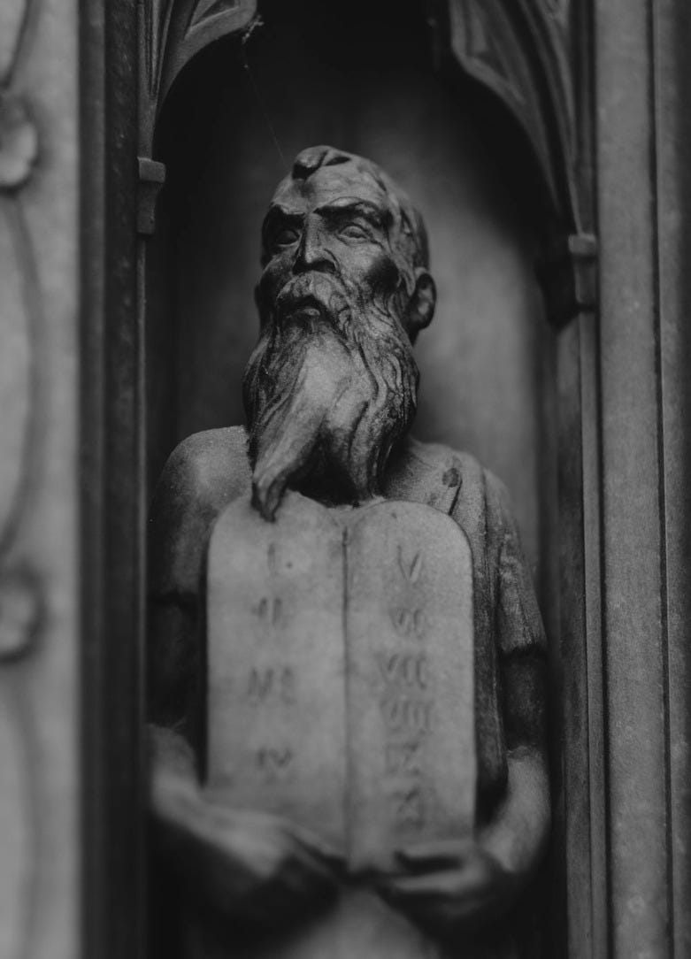 gray concrete statue of a woman