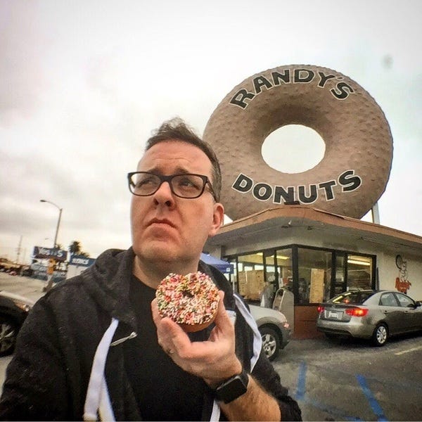Pictured: Author consumes VERY* healthy donut (*don't check) Pictured: Author consumes VERY* healthy donut (*don't check)