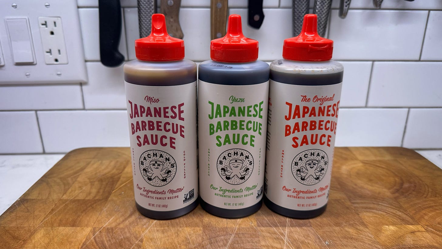 Three bottles of Bachan's Japanese Barbecue Sauce. From left to right the varieties are Miso, Yuzu, and The Original