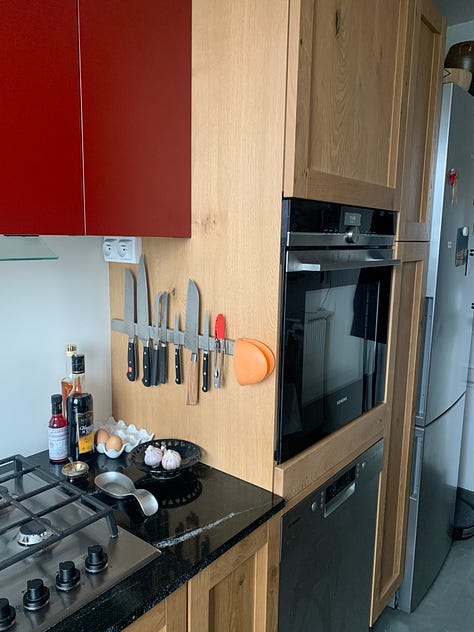 A man does DIY kitchen renovation in a Paris apartment