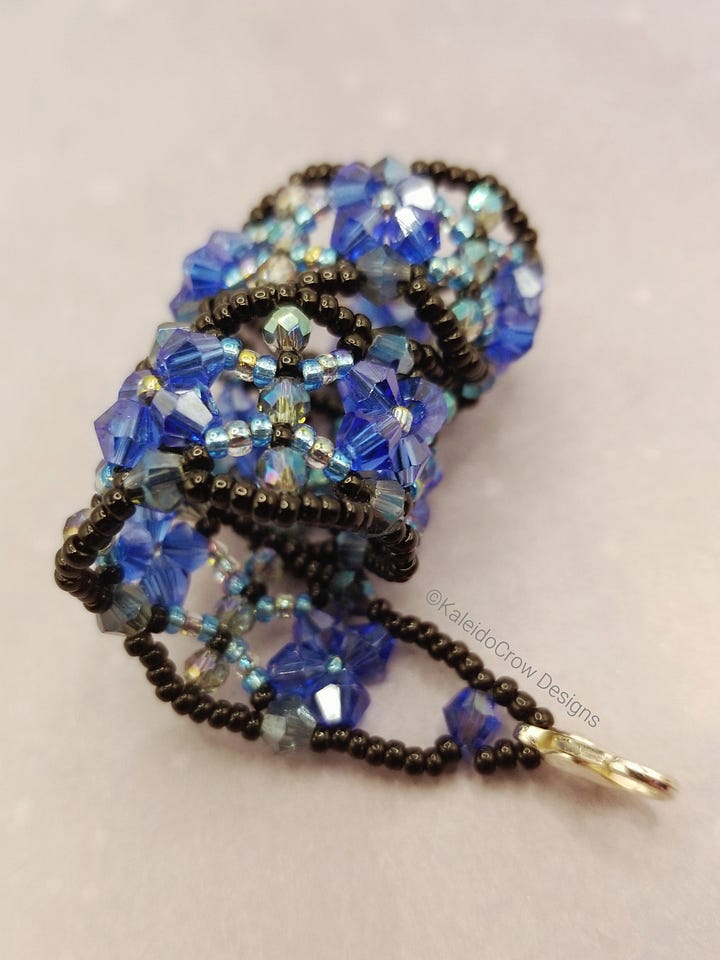 sparkly beaded bracelet made of blue and black glass beads