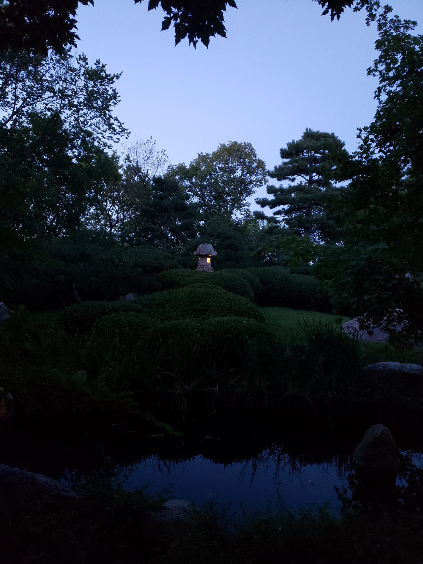 A lantern is shining in the Japanese Garden at Como.