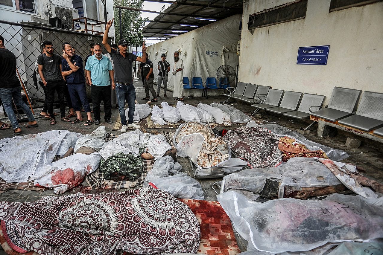 Palestinians wait to receive the bodies of their relatives who were killed in an Israeli airstrike, at Al-Najjar Hospital in Rafah, southern Gaza Strip, October 24, 2023. (Abed Rahim Khatib/Flash90) Palestinians wait to receive the bodies of their relatives who were killed in an Israeli airstrike, at Al-Najjar Hospital in Rafah, southern Gaza Strip, October 24, 2023. (Abed Rahim Khatib/Flash90)
