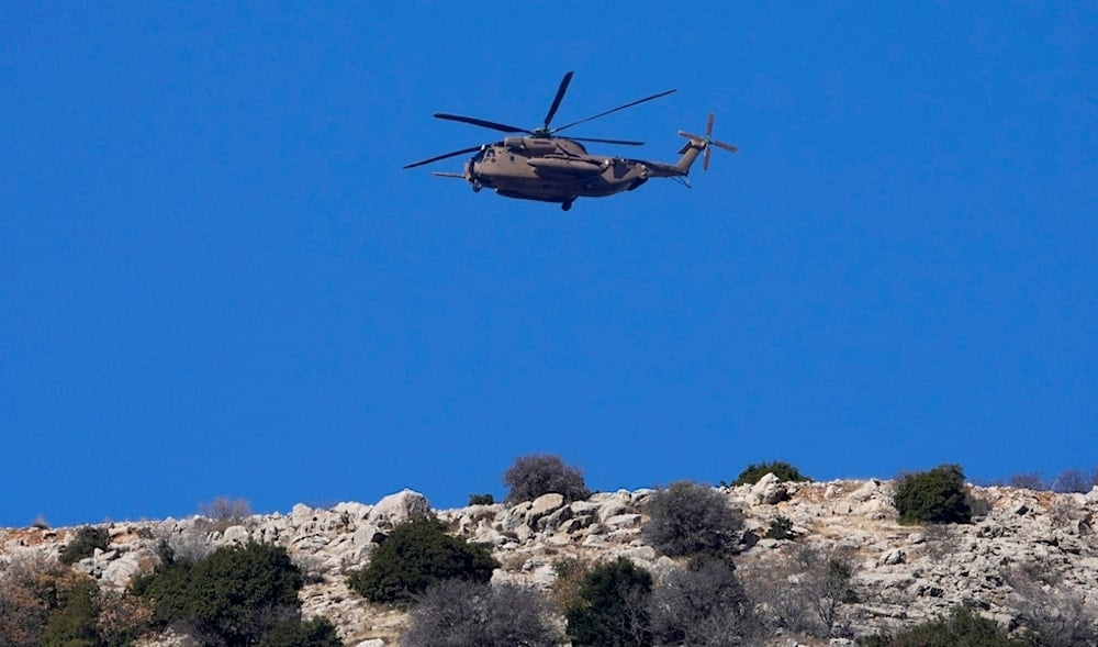 An Israeli occupation Air Force Black Hawk helicopter flies over Mount Hermon near the so-called Alpha Line that separates the Israeli-occupied Golan Heights from Syria, Dec. 17, 2024. (AP) An Israeli occupation Air Force Black Hawk helicopter flies over Mount Hermon near the so-called Alpha Line that separates the Israeli-occupied Golan Heights from Syria, Dec. 17, 2024. (AP)