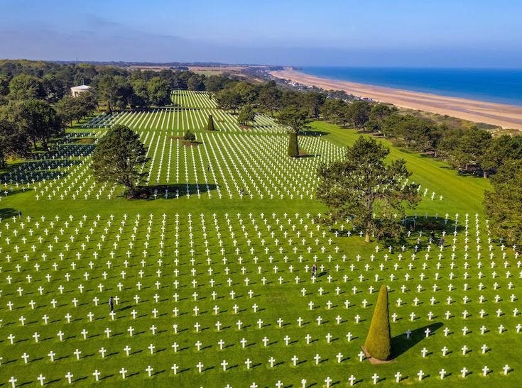 This may contain: an aerial view of a large cemetery near the ocean