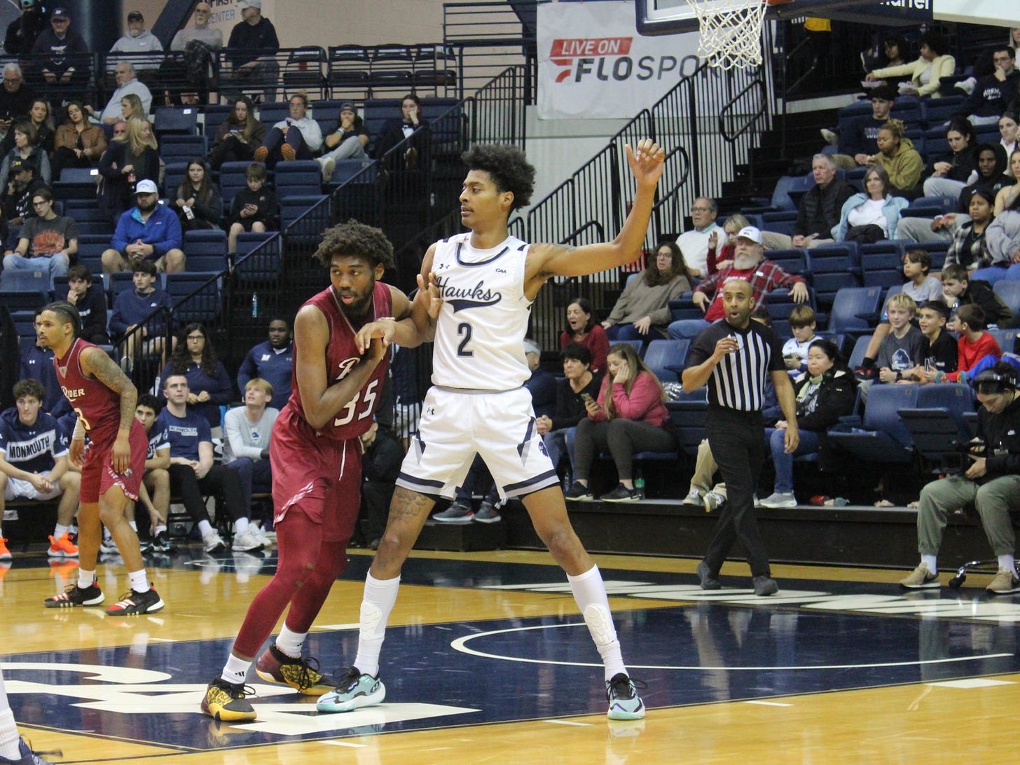 Monmouth’s Jaret Valencia (2) battles with Rider’s T.J. Weeks Jr. during a home win on Dec. 16, 2023. (Photo by Adam Zielonka) Monmouth’s Jaret Valencia (2) battles with Rider’s T.J. Weeks Jr. during a home win on Dec. 16, 2023. (Photo by Adam Zielonka)