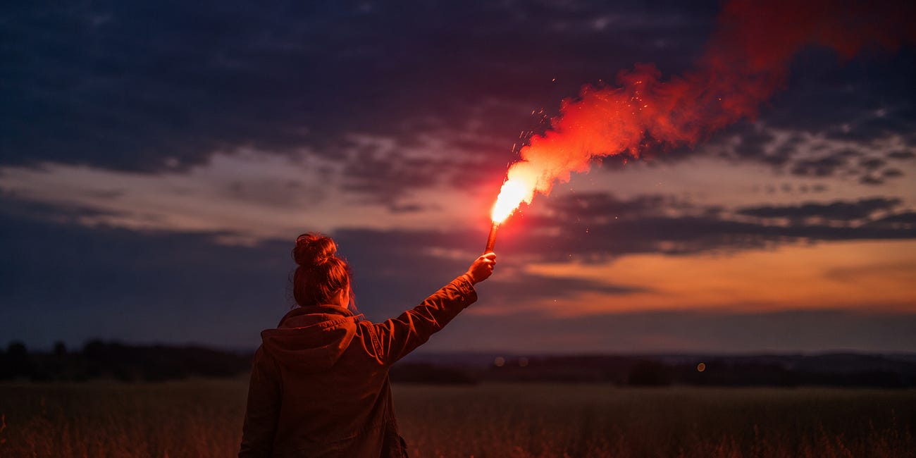 Standing in a Field With a Flare