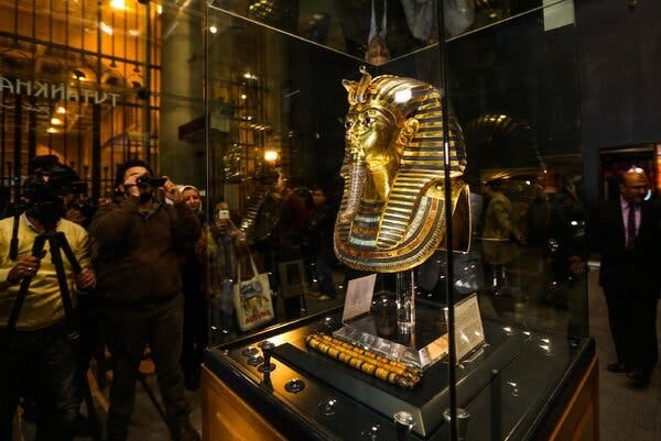 The golden funerary mask of King Tutankhamun, who died in 1,323 B.C. at age 19, on display behind glass at the Egyptian Museum in Cairo in 2015. The golden funerary mask of King Tutankhamun, who died in 1,323 B.C. at age 19, on display behind glass at the Egyptian Museum in Cairo in 2015.