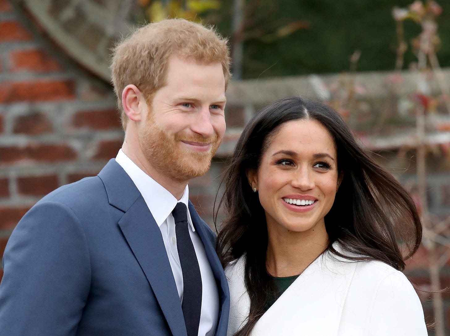 Prince Harry and Meghan smiling