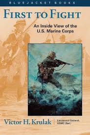 Book cover of First to Fight: An Inside View of the U.S. Marine Corps by Lieutenant General Victor H. Krulak, USMC (Ret.). The design features a Marine advancing through surf with rifle in hand, set against a tan and blue background under the Bluejacket Books series banner.