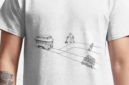 Photo of mdel in T-shirt depicting the Trolley Problem Photo of mdel in T-shirt depicting the Trolley Problem