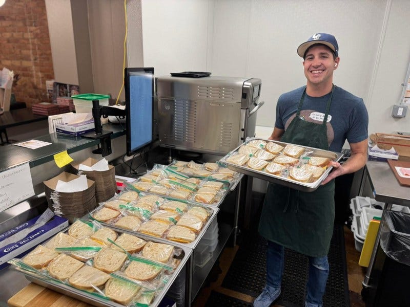 Elliot making sandwiches at Novel