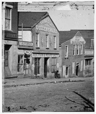 Slave auction in on Whitehall Street.